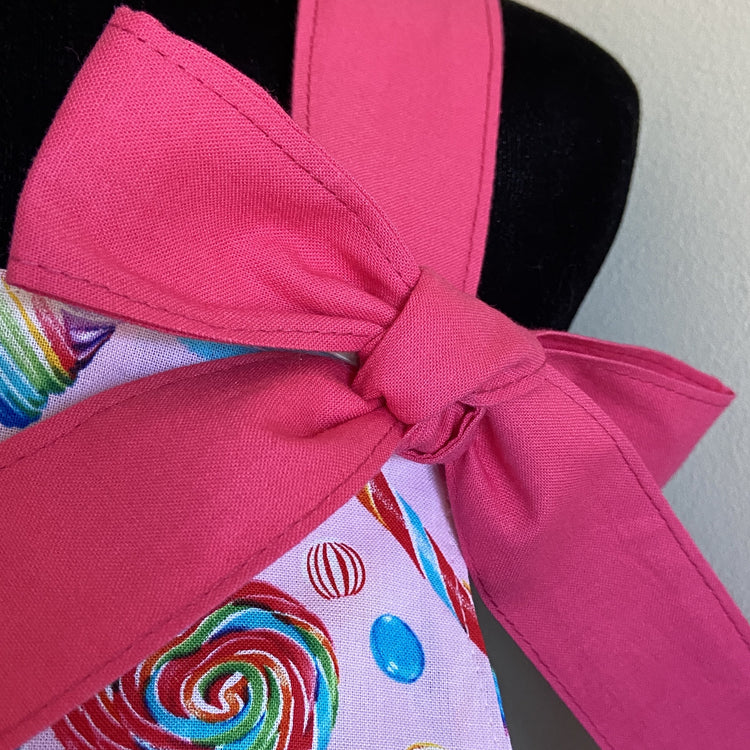 Pink bow on apron