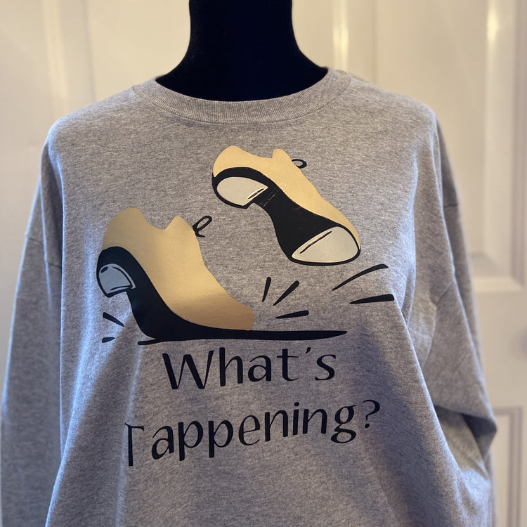 Gray t-shirt with gold tap shoes, “What’s Tappening?”.