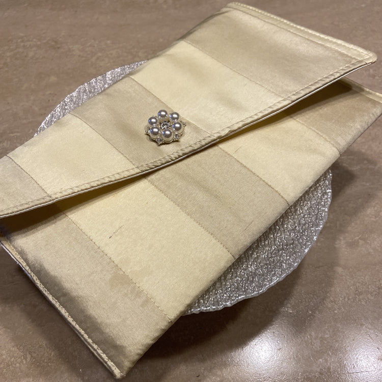 Handmade cream silk clutch handbag with brooch closure