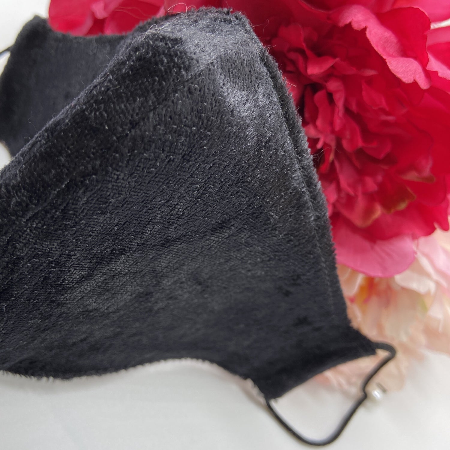 Soft black mask with pearl ear adjusters 