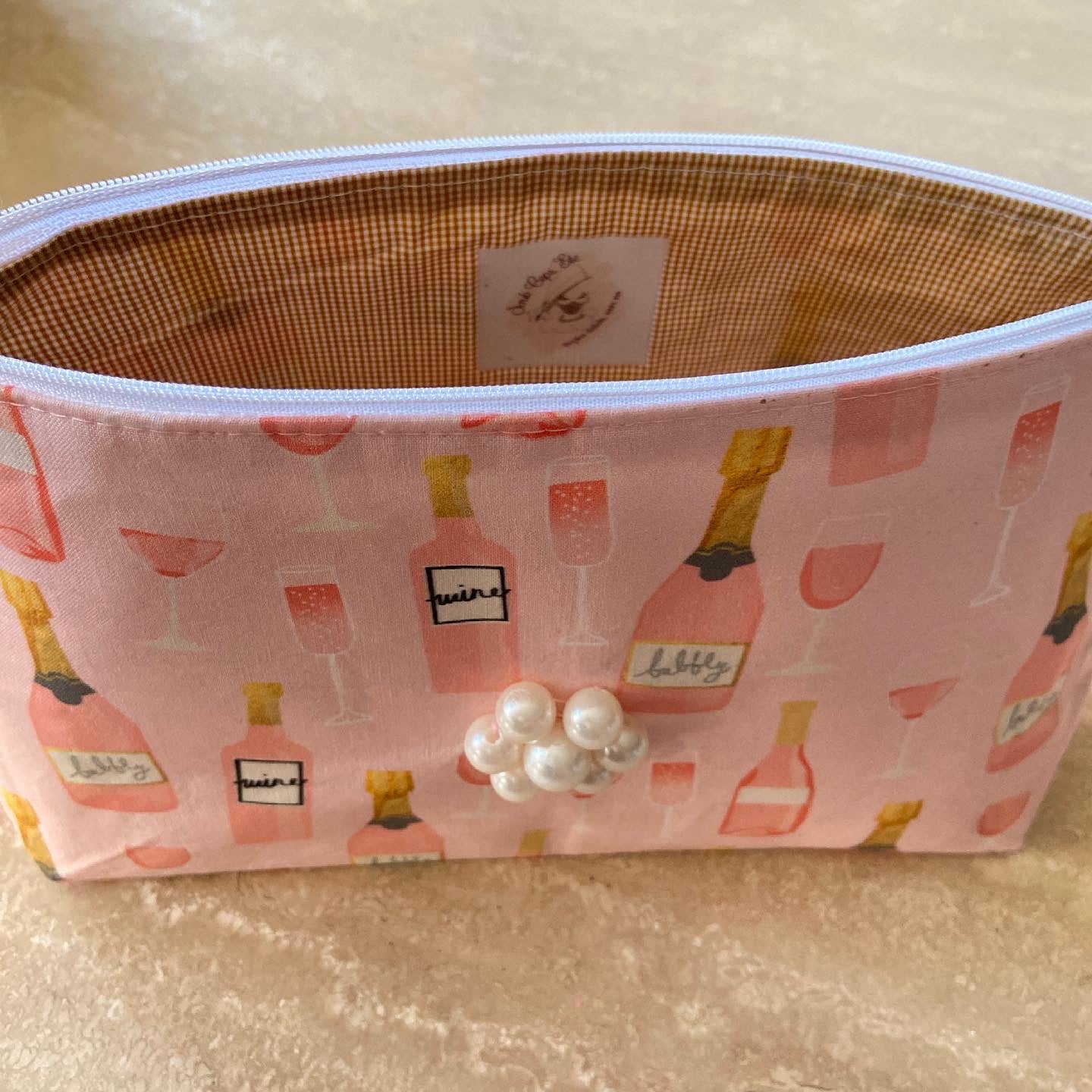Pink wine/champagne cosmetic bag