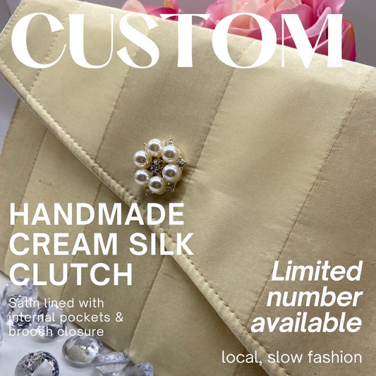 Handmade cream silk clutch handbag with brooch closure