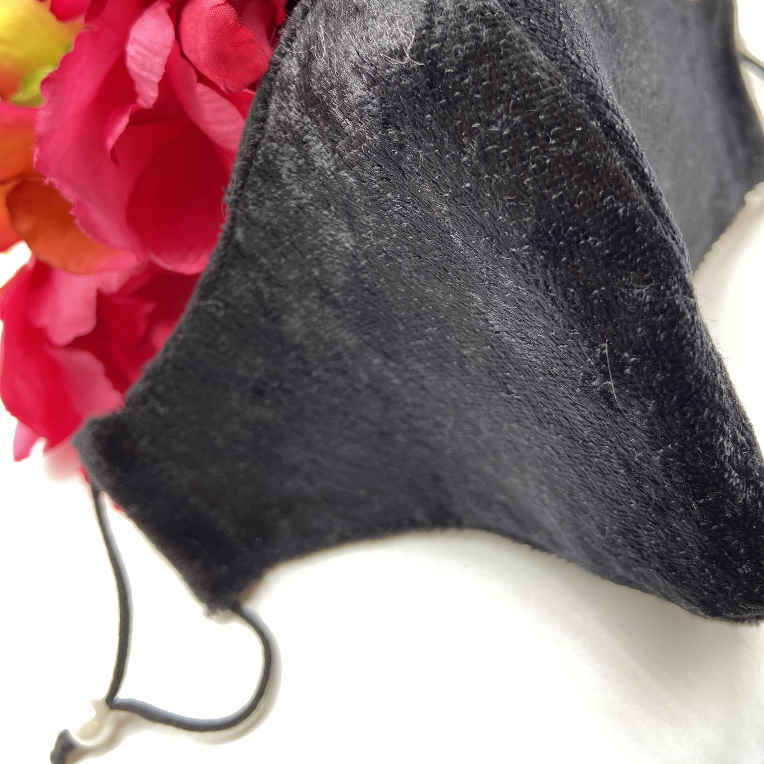 Soft black mask with pearl ear adjusters 