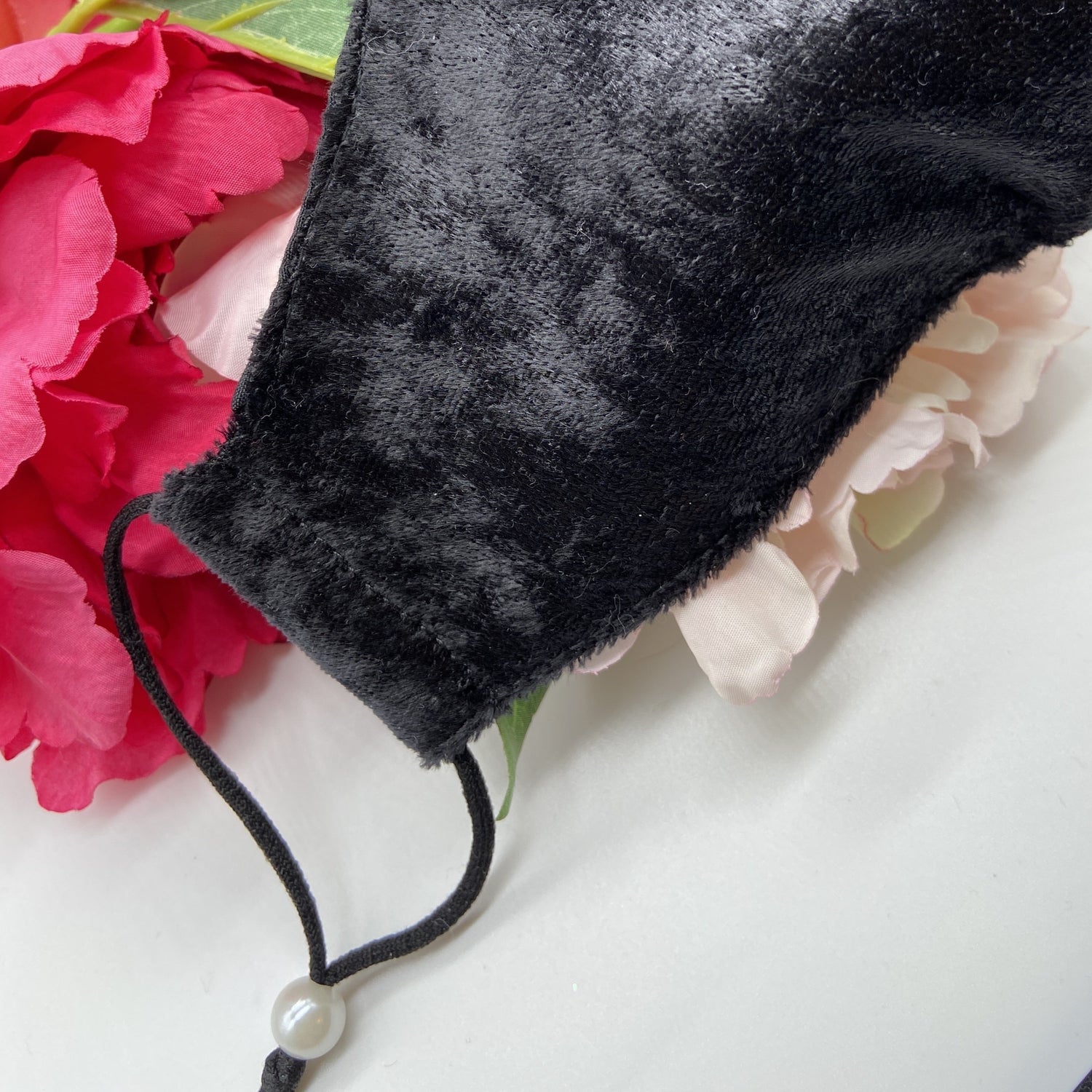 Soft black mask with pearl ear adjusters 