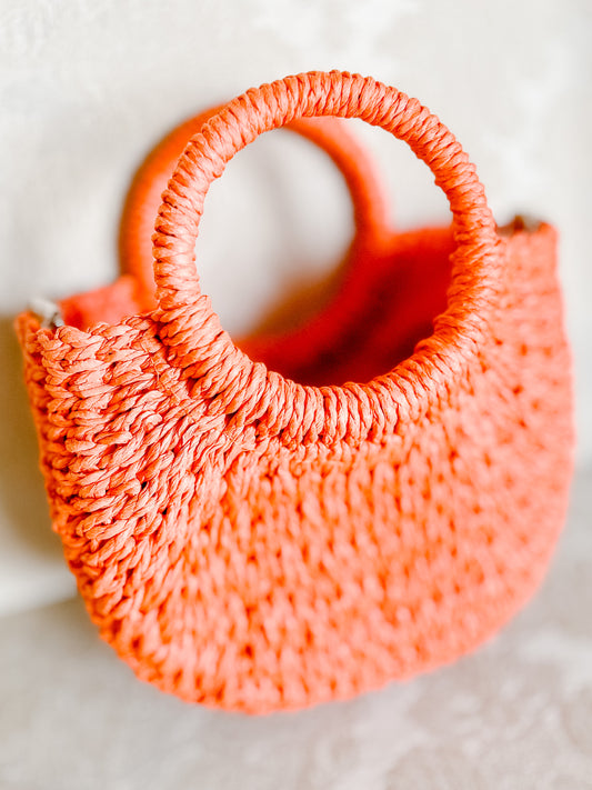Orange Straw Handbag with Detachable Strap & Drawstring Closure